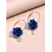 Aretes largos con flor azul