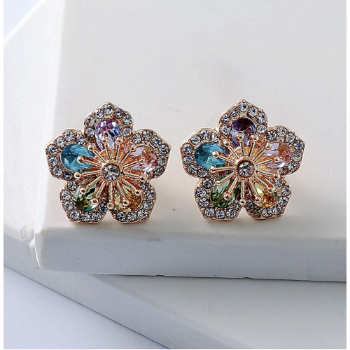 Aretes de botón con diamante de imitación con diseño de flor